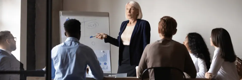 Train the trainer workshop with facilitator presenting to group audience